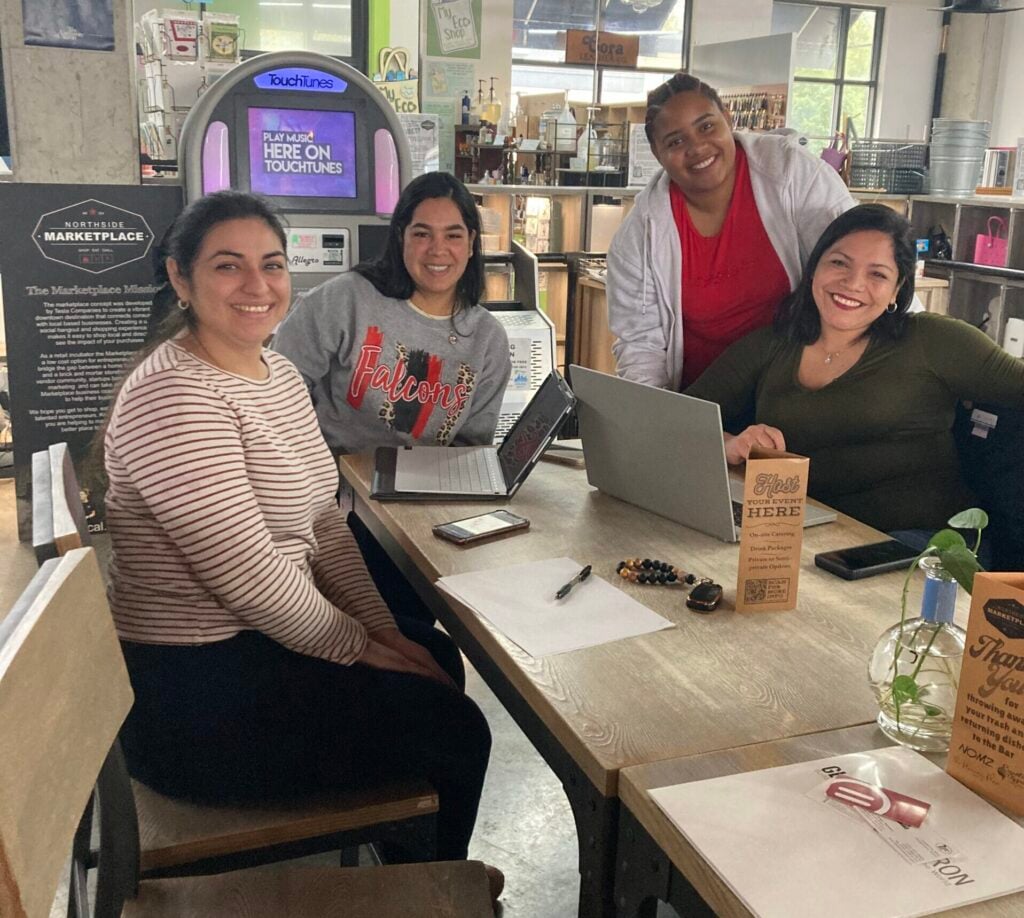 Artrepreneur program participants learning creative business skills and global market strategy.