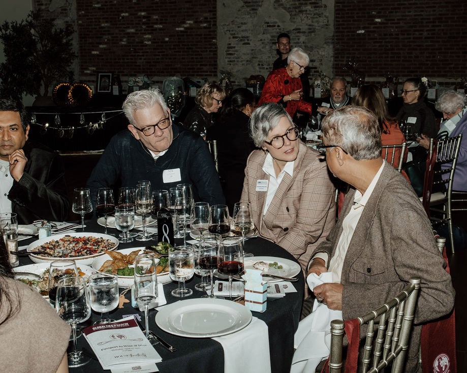 Guests enjoying international cuisine during networking event for Akron business leaders.