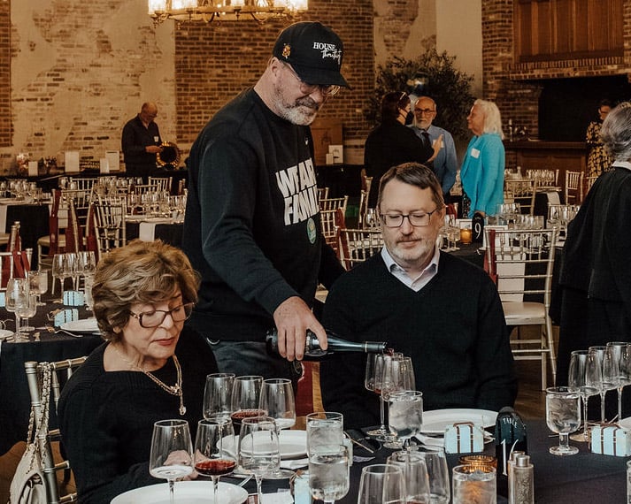 Volunteers welcoming attendees to Global Ties Akron gala focused on community impact.
